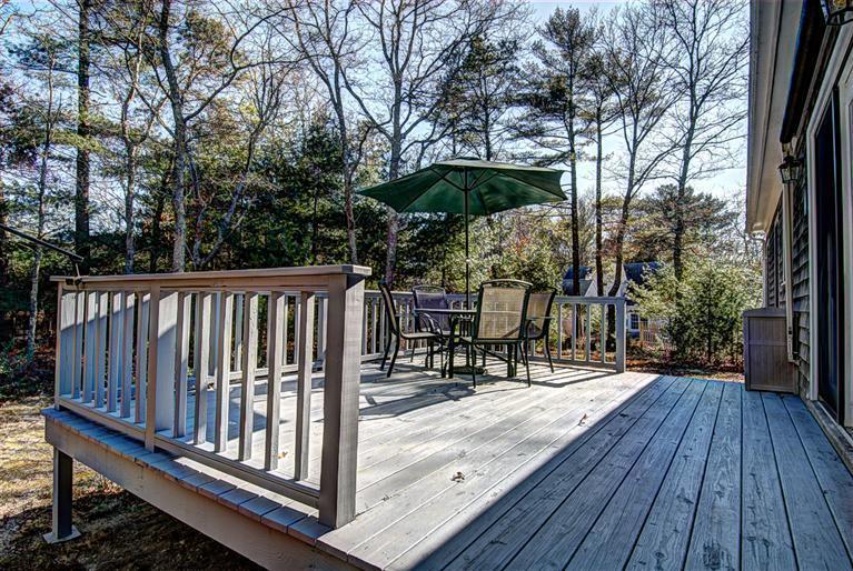 80 Sea Robin Road Osterville, MA 02655 - Photo 3 of 20 a view of backyard with a deck and wooden floor