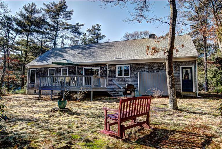80 Sea Robin Road Osterville, MA 02655 - Photo 4 of 20 a patio with a table and chairs and potted plants