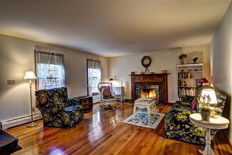 80 Sea Robin Road Osterville, MA 02655 - Photo 5 of 20 a living room with furniture and a fireplace