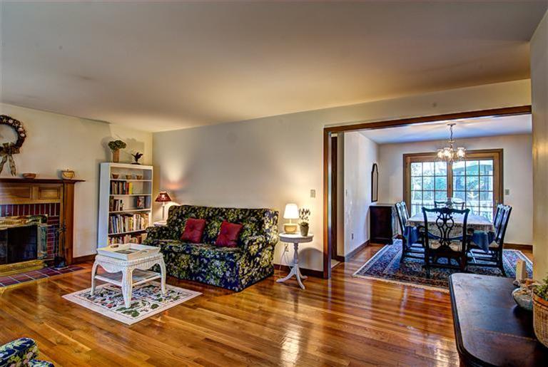 80 Sea Robin Road Osterville, MA 02655 - Photo 7 of 20 a living room with furniture a flat screen tv and a fireplace
