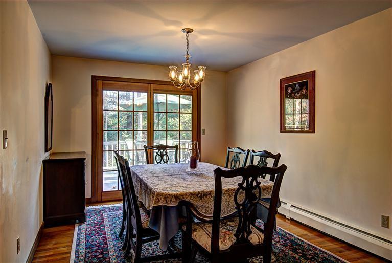 80 Sea Robin Road Osterville, MA 02655 - Photo 8 of 20 a view of a dining room with furniture window and wooden floor