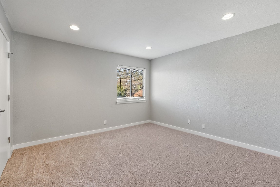 3601 Menchaca Road, Unit 117 Austin, TX 78704 - Photo 18 of 29 Spare room with light colored carpet and recessed lighting