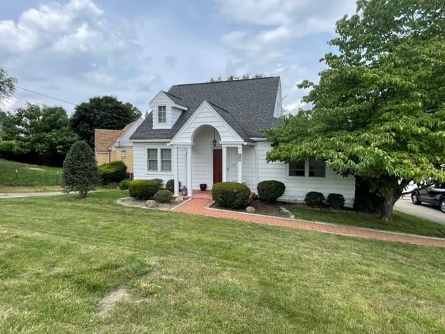 1955 Ridge Rd Extension Ambridge, PA 15003 - Photo 1 of 27 a front view of a house with yard and green space