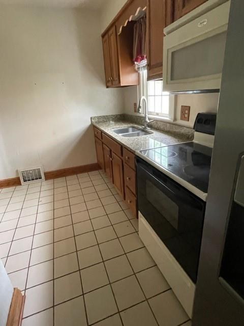1955 Ridge Rd Extension Ambridge, PA 15003 - Photo 13 of 27 a kitchen with a sink a stove and cabinets