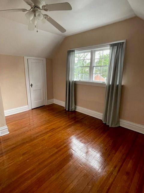 1955 Ridge Rd Extension Ambridge, PA 15003 - Photo 17 of 27 an empty room with wooden floor and windows