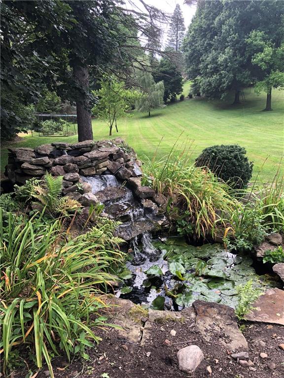 1955 Ridge Rd Extension Ambridge, PA 15003 - Photo 3 of 27 a view of a garden with a lake
