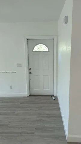 a view of a livingroom from a hallway