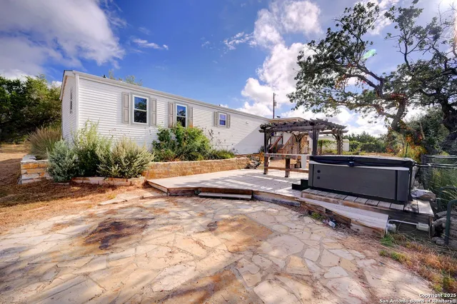 a view of a backyard with sitting area