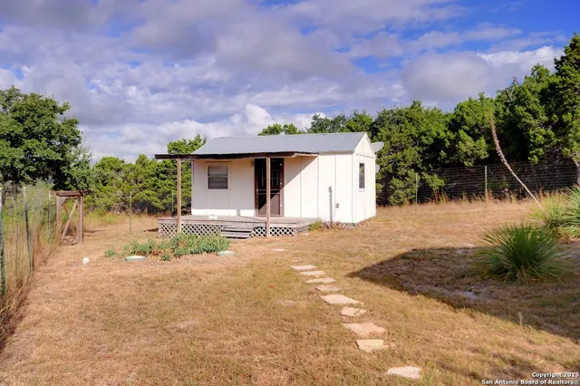 a front view of a house with a yard and a garage