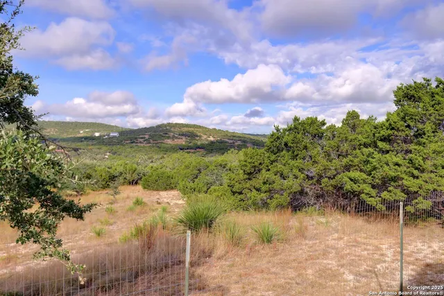 a view of lake with green space