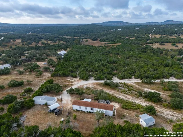 an aerial view of residential house with outdoor space