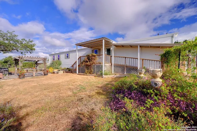 a view of a car park in front of a house