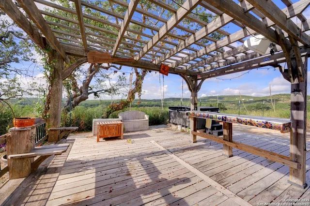 a patio view with patio couches fire pit and outdoor seating