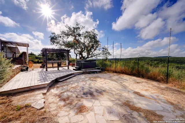 a view of a patio with swimming pool