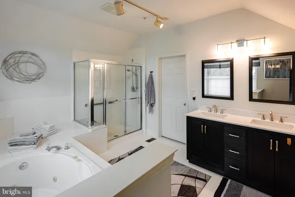 a view of a roof deck with table and chairs and wooden floor