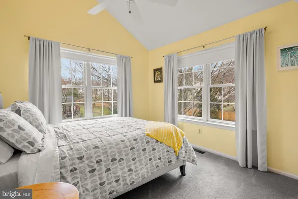 a view of a yard with wooden fence