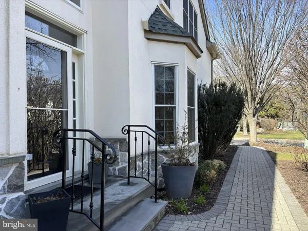 a view of a livingroom with wooden floor and furniture