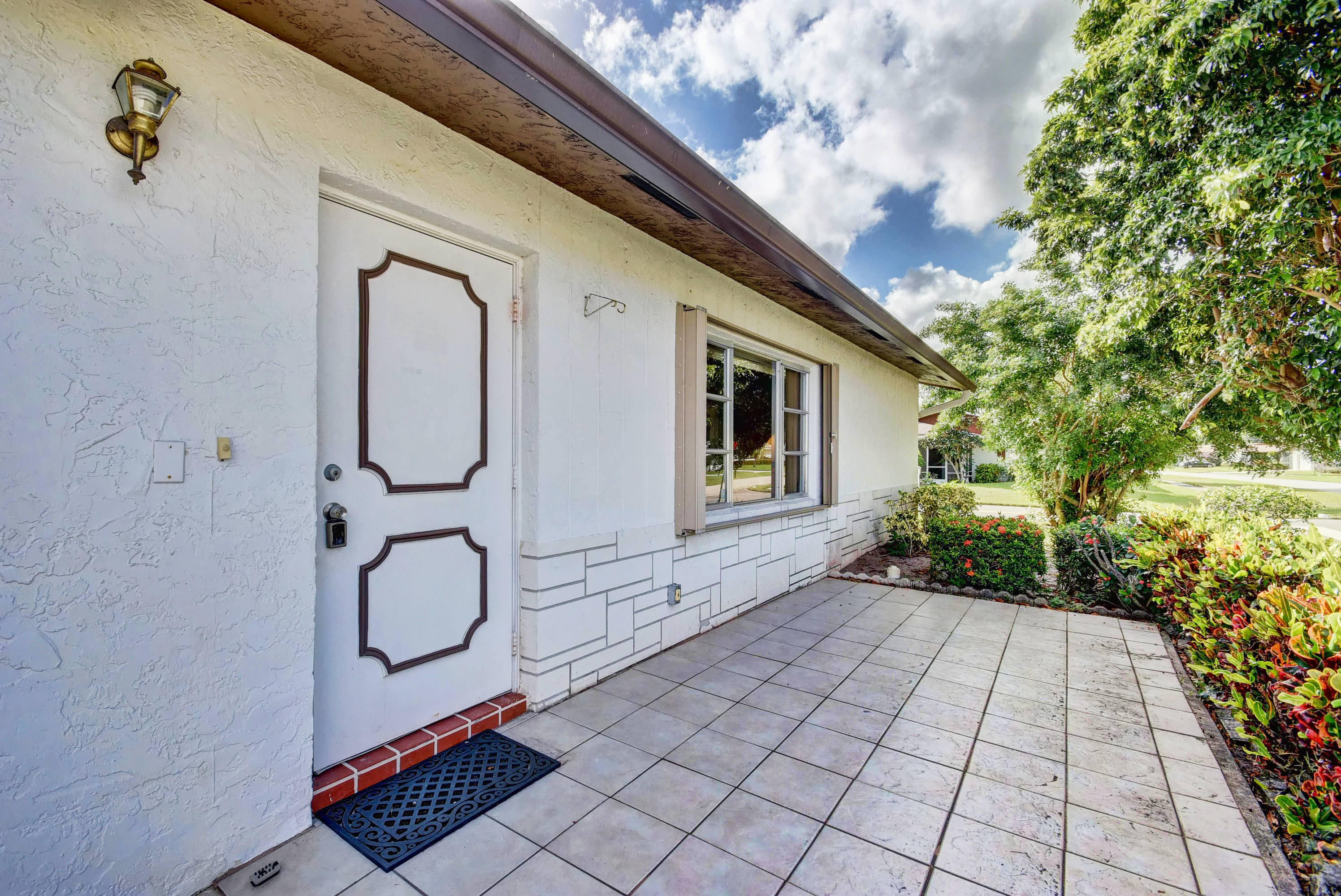 6295 Dusenburg Road Delray Beach, FL 33484 - Photo 6 of 34 a view of a entryway door front of house