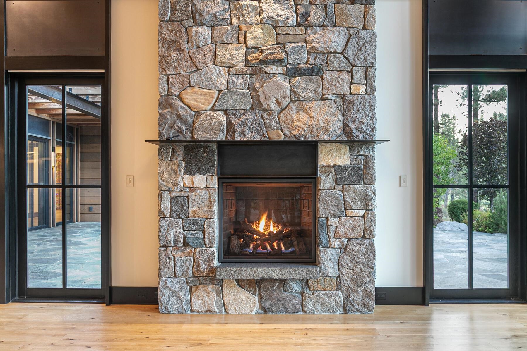 11454 Henness Road Truckee, CA 96161 - Photo 11 of 27 a view of a fireplace wooden floor and window