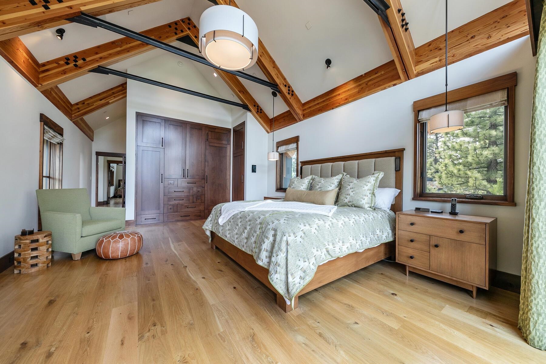 11454 Henness Road Truckee, CA 96161 - Photo 12 of 27 a bedroom with a bed and wooden floor