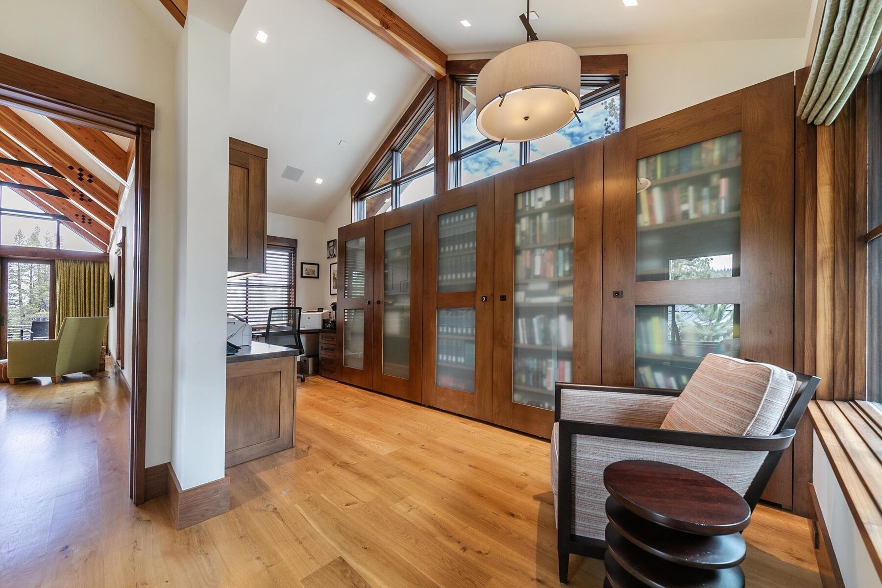 11454 Henness Road Truckee, CA 96161 - Photo 15 of 27 a living room with couches a dining table and chairs with wooden floor