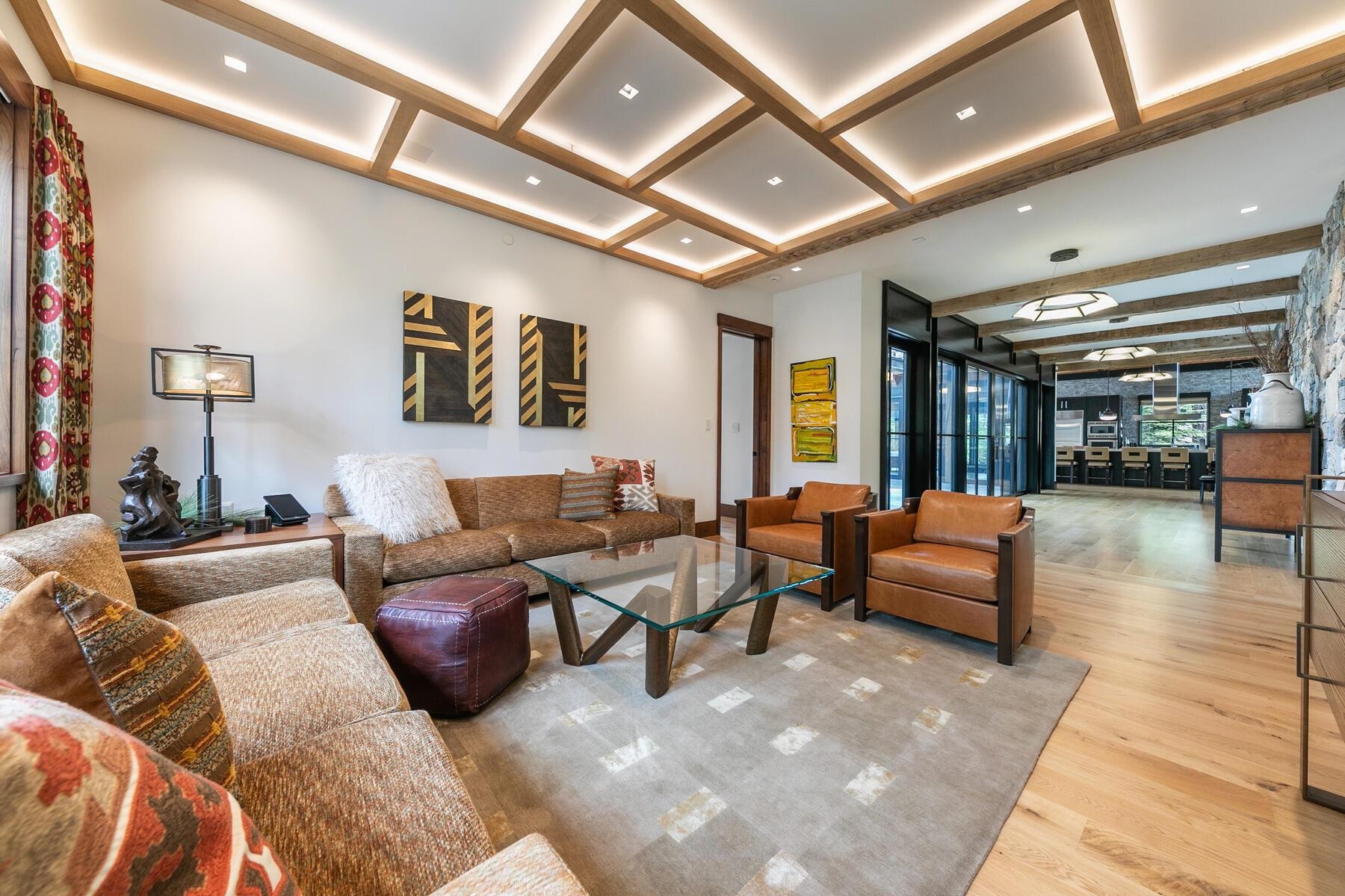 11454 Henness Road Truckee, CA 96161 - Photo 18 of 27 a living room with furniture a rug and a chandelier
