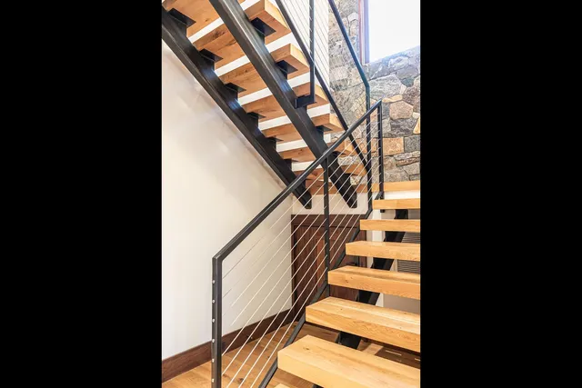 a view of a city with lush green forest