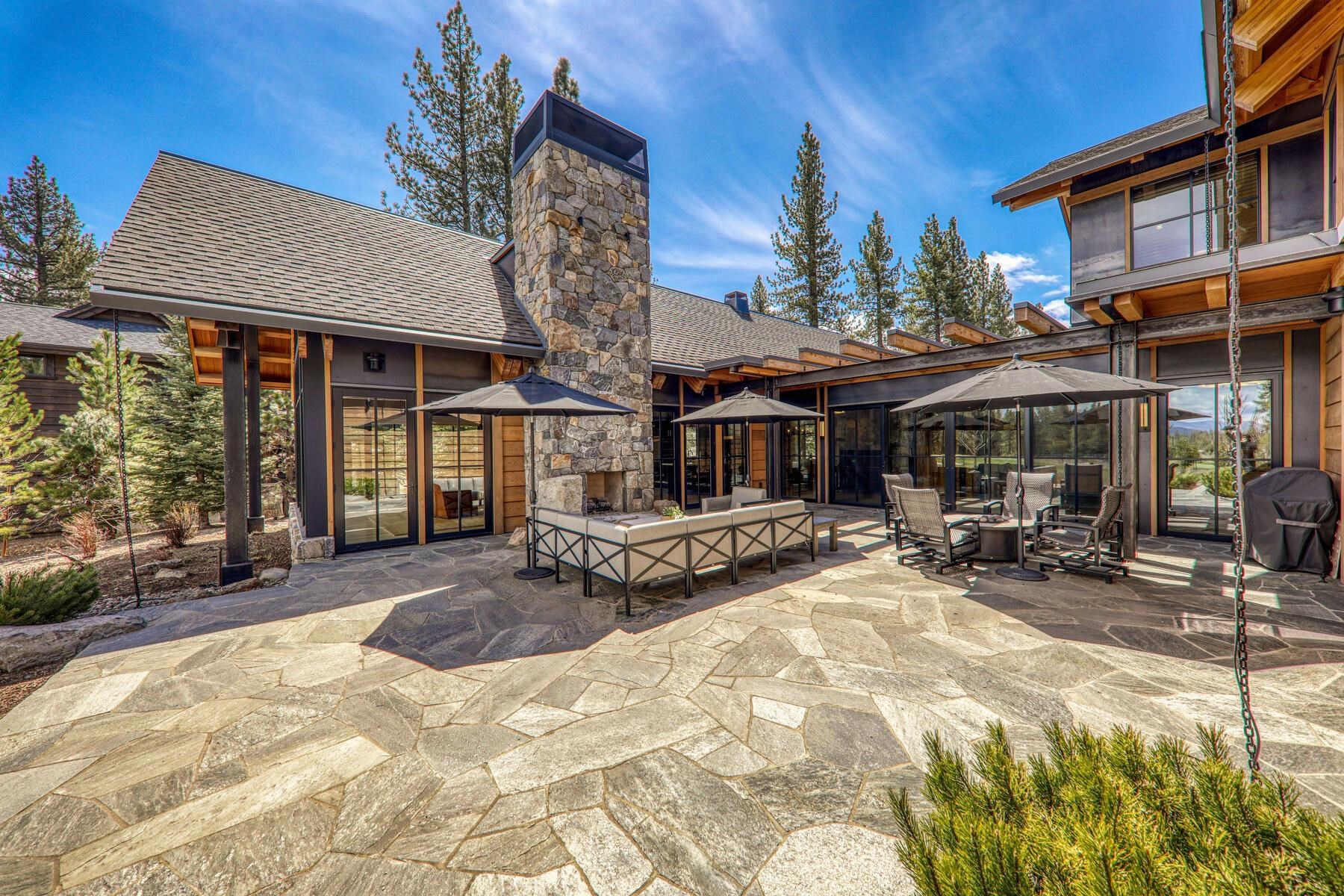11454 Henness Road Truckee, CA 96161 - Photo 4 of 27 a view of a house with floor to ceiling windows and a basket ball poll