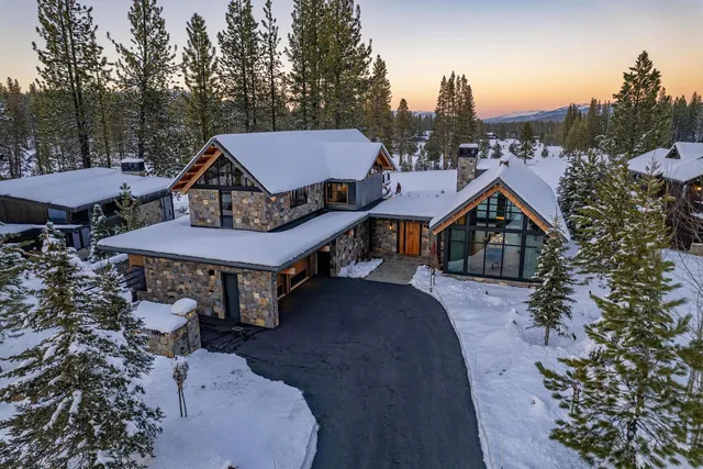 a kitchen with stainless steel appliances granite countertop lots of counter top space and wooden floor