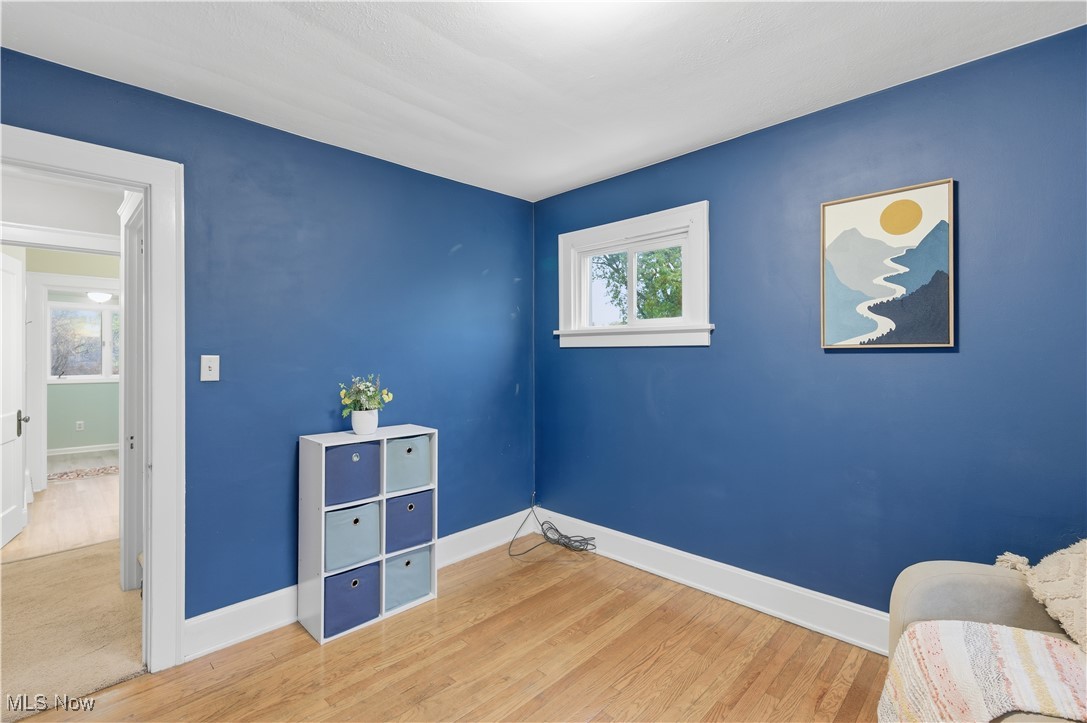 1017 Spring Road Cleveland, OH 44109 - Photo 25 of 47 Bedroom featuring baseboards and wood finished floors