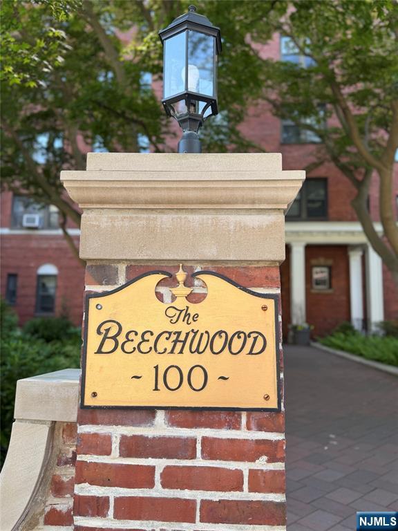 100 Prospect Avenue, Unit 2E Hackensack, NJ 07601 - Photo 2 of 16 a sign that is on a brick building