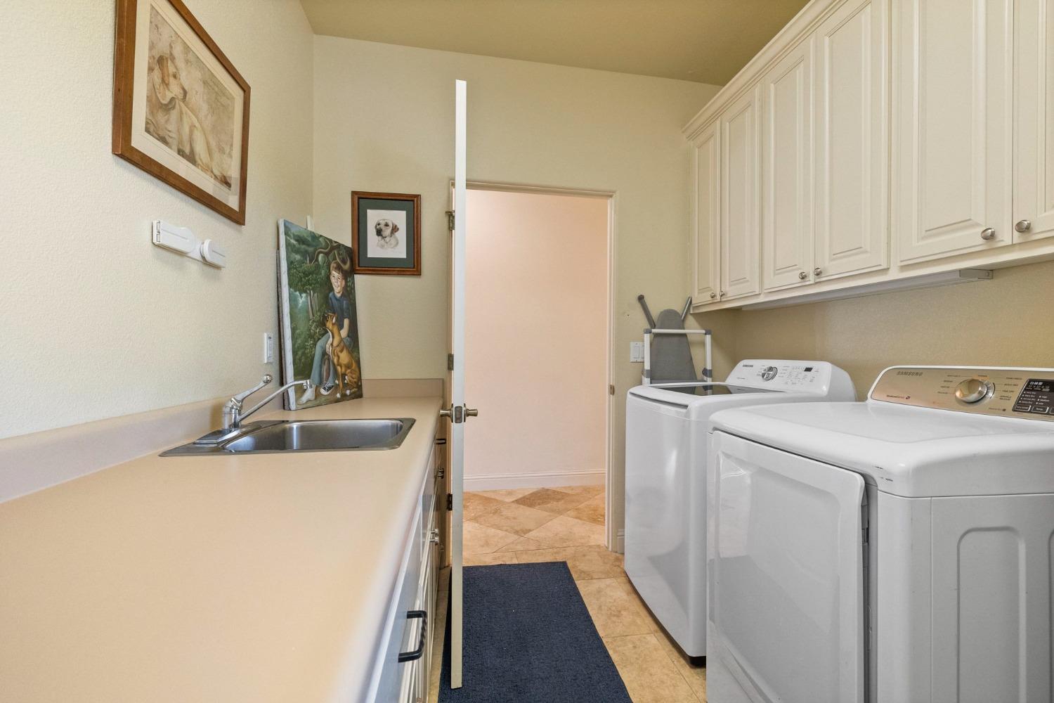 16 Flagstone Court Copperopolis, CA 95228 - Photo 35 of 45 a utility room with dryer and washer