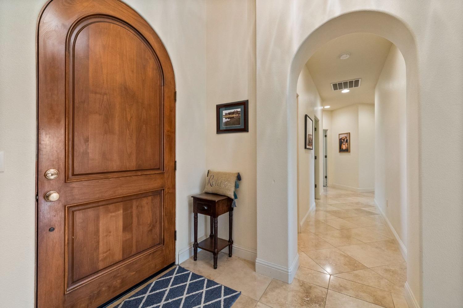 16 Flagstone Court Copperopolis, CA 95228 - Photo 5 of 45 a view of a livingroom with furniture and wooden door