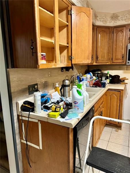 616 Sandy Hill Road Irwin, PA 15642 - Photo 12 of 38 a kitchen with a sink a stove and a microwave
