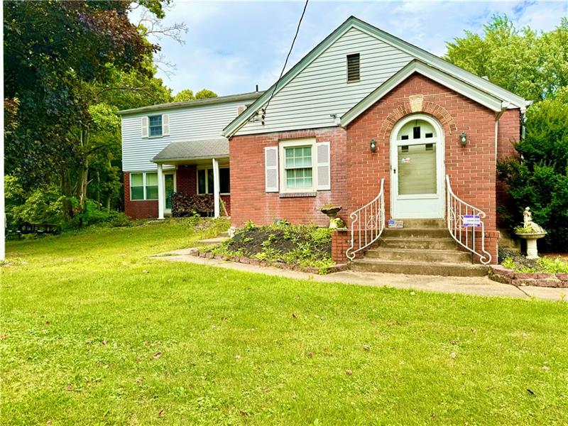 616 Sandy Hill Road Irwin, PA 15642 - Photo 2 of 38 a front view of a house with a yard