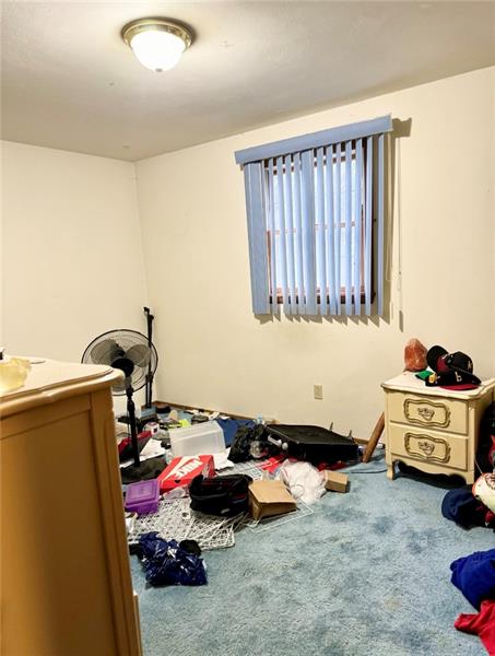 616 Sandy Hill Road Irwin, PA 15642 - Photo 22 of 38 a room with furniture and a window