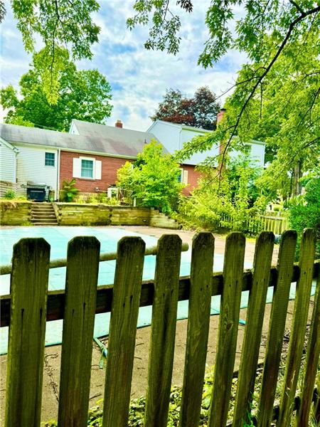 616 Sandy Hill Road Irwin, PA 15642 - Photo 29 of 38 a front view of a house with a yard table and chairs
