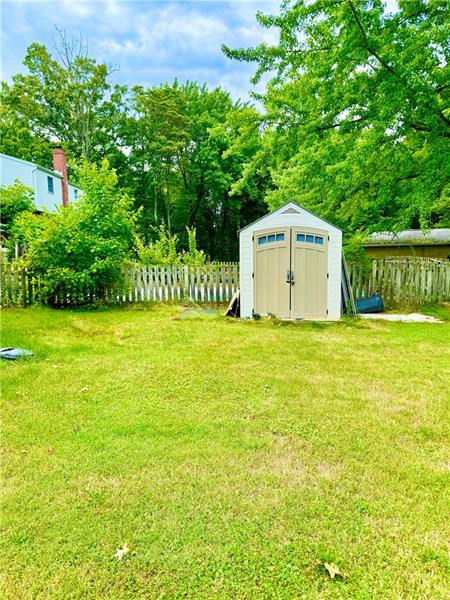 616 Sandy Hill Road Irwin, PA 15642 - Photo 35 of 38 a white house with a big yard and large trees