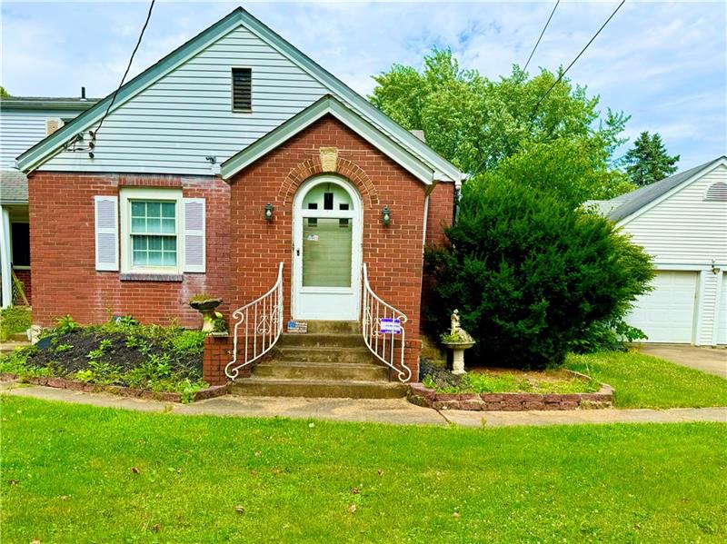 616 Sandy Hill Road Irwin, PA 15642 - Photo 37 of 38 a front view of a house with a yard