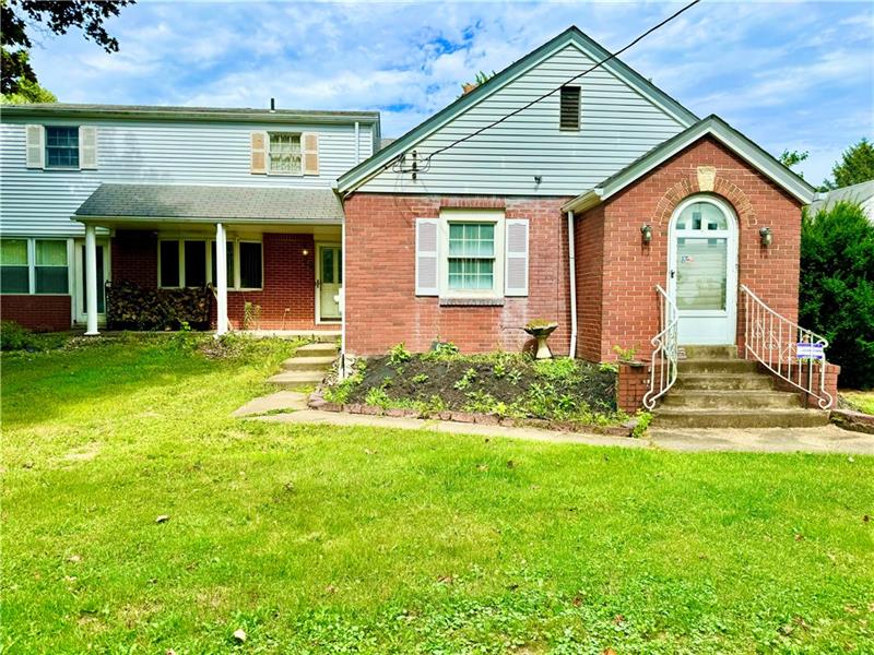 616 Sandy Hill Road Irwin, PA 15642 - Photo 38 of 38 a front view of a house with a yard