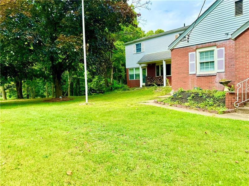 616 Sandy Hill Road Irwin, PA 15642 - Photo 6 of 38 a view of a house with a yard and sitting area