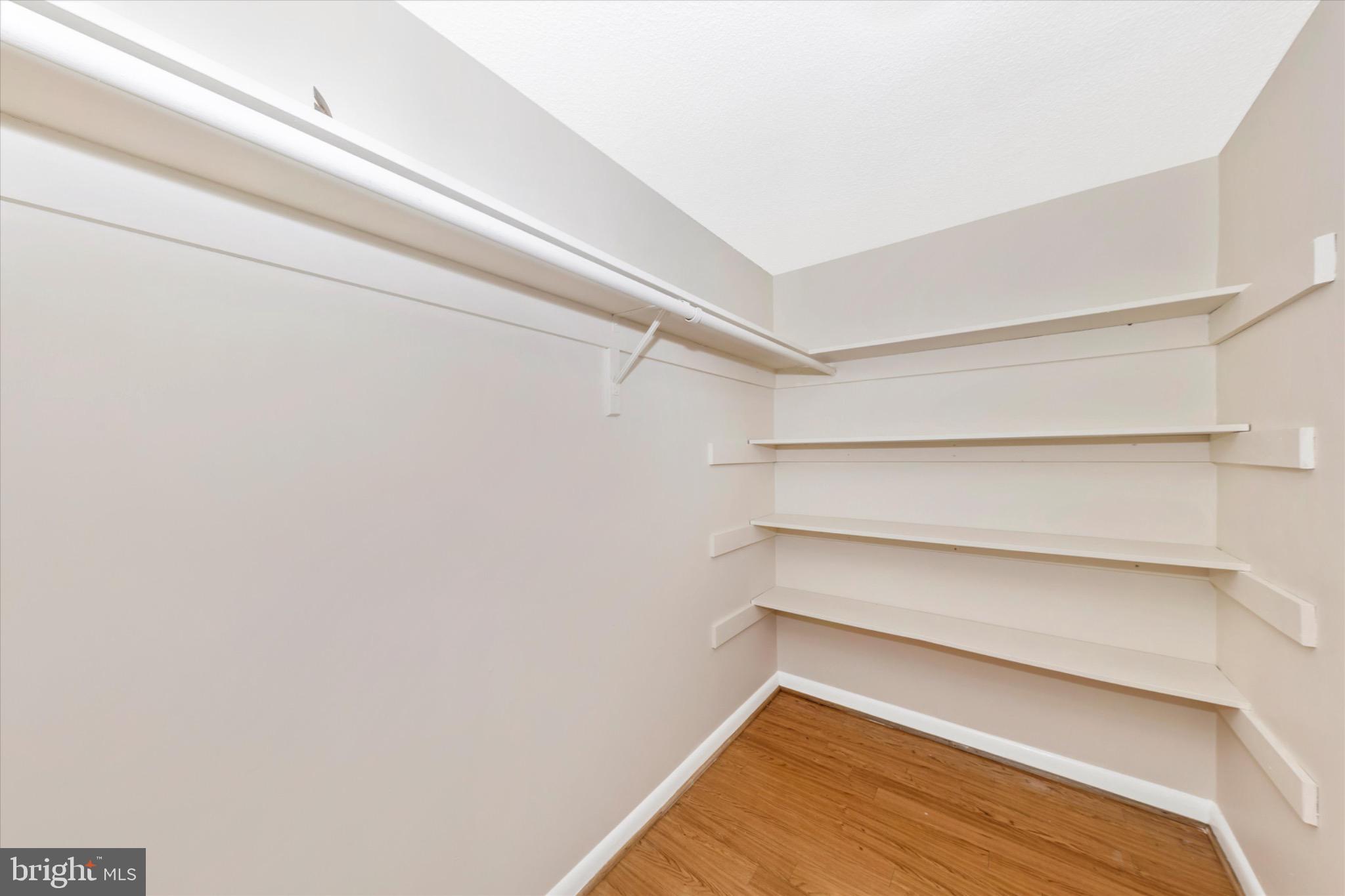 3215 South Leisure World Boulevard, Unit 1011 Silver Spring, MD 20906 - Photo 12 of 27 a view of an empty walk in closet