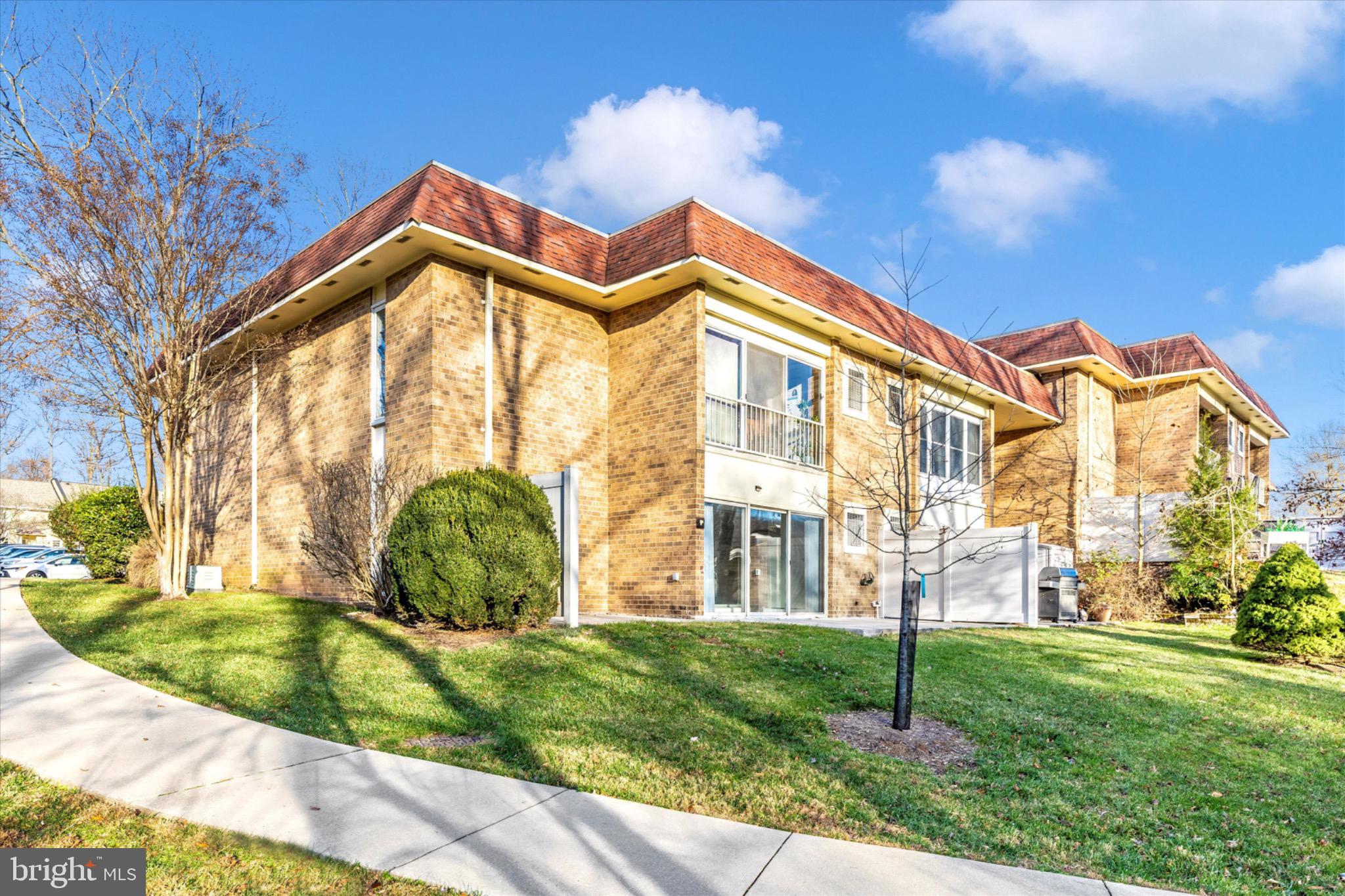 3215 South Leisure World Boulevard, Unit 1011 Silver Spring, MD 20906 - Photo 14 of 27 a view of a house with a yard