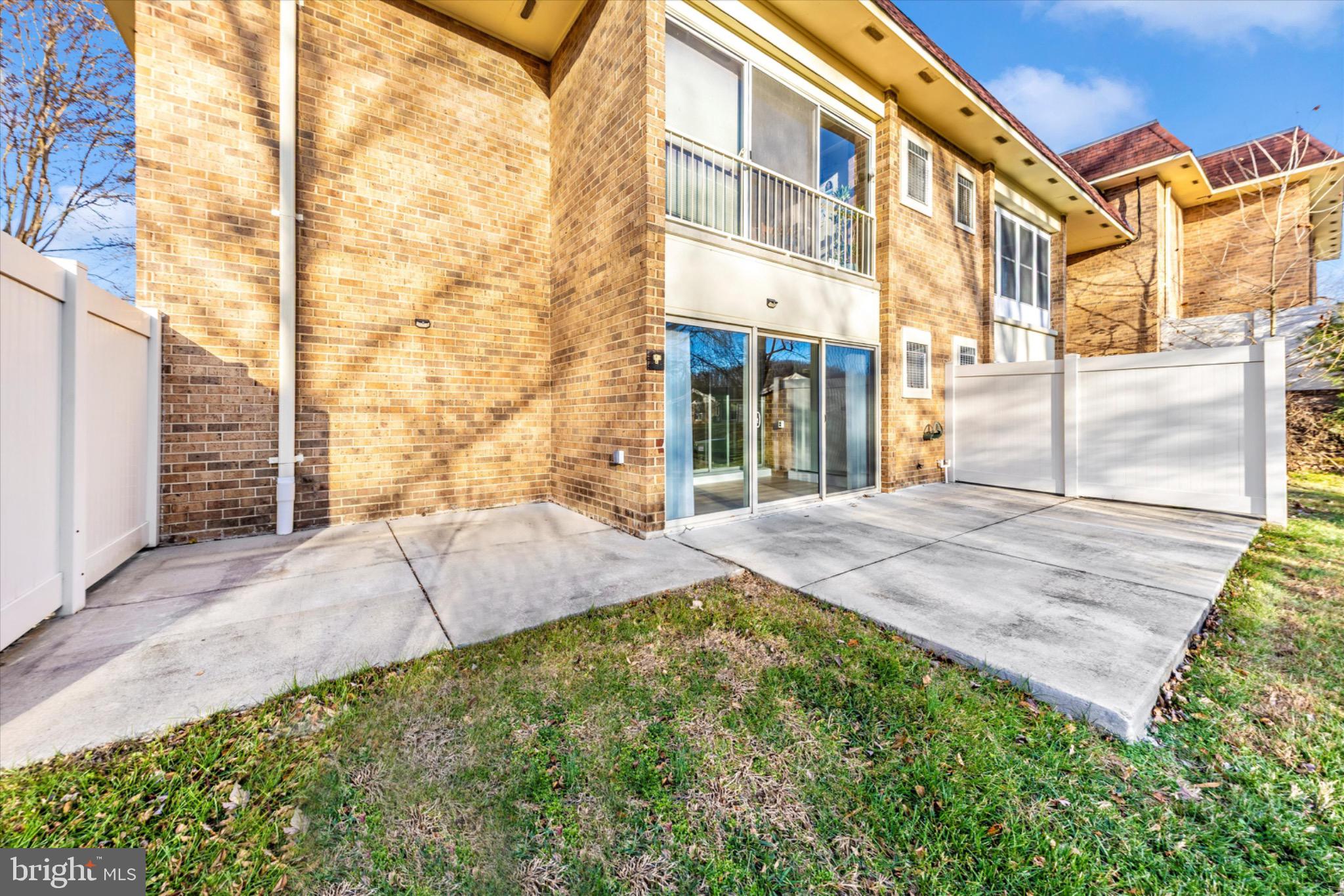3215 South Leisure World Boulevard, Unit 1011 Silver Spring, MD 20906 - Photo 16 of 27 a front view of a building with a garden