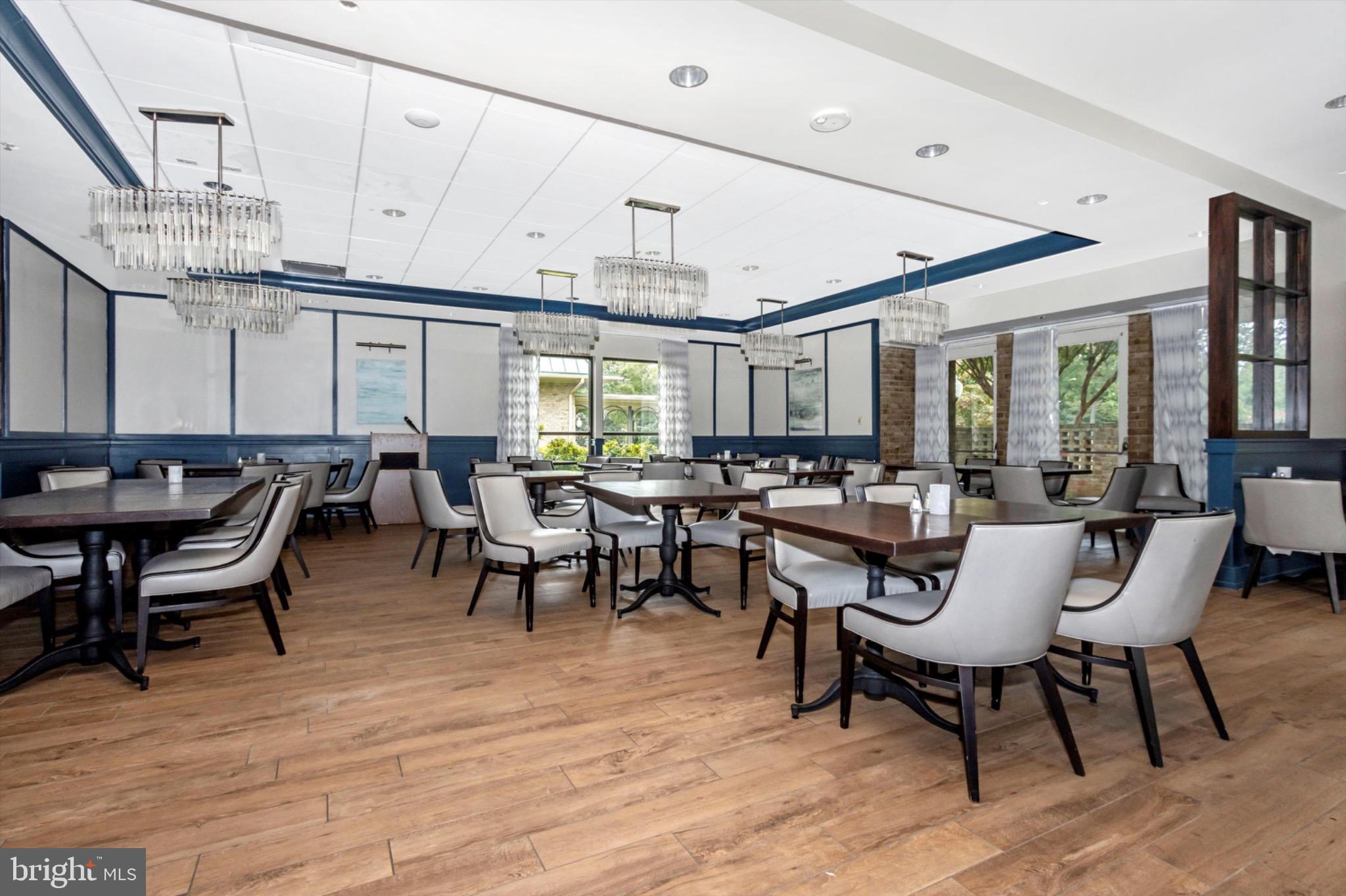 3215 South Leisure World Boulevard, Unit 1011 Silver Spring, MD 20906 - Photo 19 of 27 a group of people sitting at tables in a room