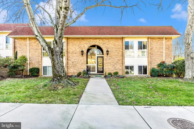 a front view of a house with yard