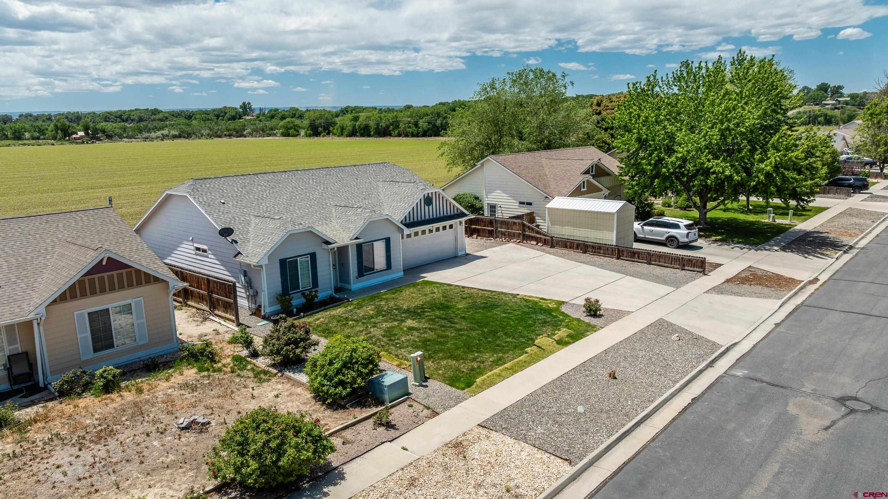 544 20th Street Delta, CO 81416 - Photo 37 of 44 an aerial view of a house with a garden and lake view