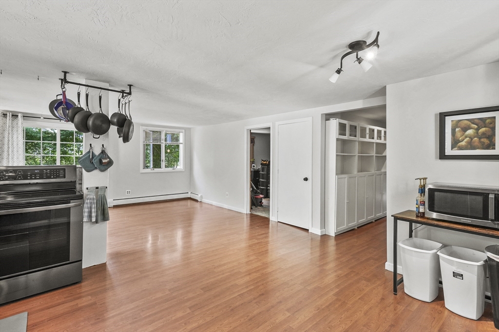 69 Appleton Road Auburn, MA 01501 - Photo 11 of 42 a view of a livingroom with furniture hardwood floor and a ceiling fan