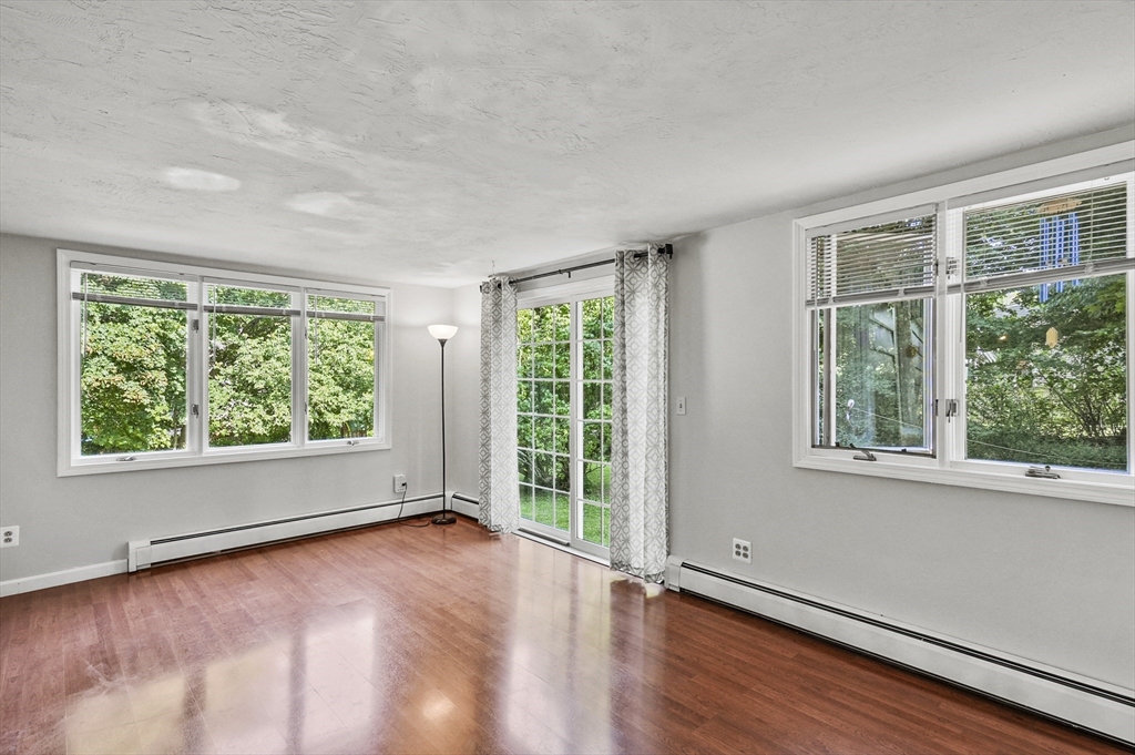 69 Appleton Road Auburn, MA 01501 - Photo 14 of 42 a view of an empty room with wooden floor and a window