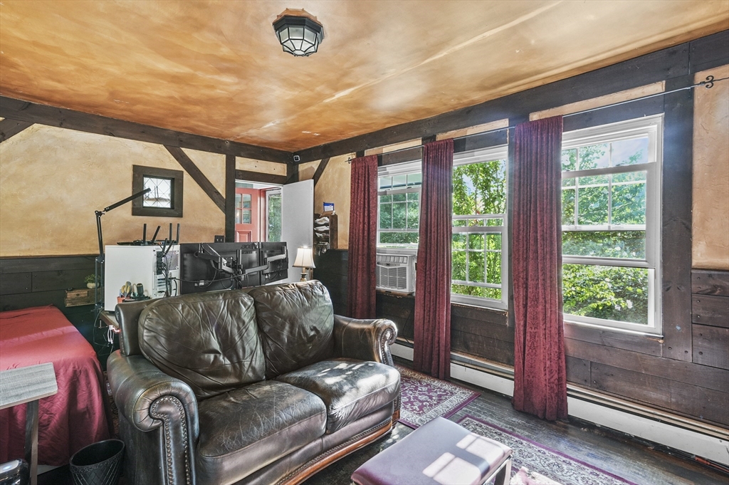 69 Appleton Road Auburn, MA 01501 - Photo 15 of 42 a living room with furniture and a floor to ceiling window